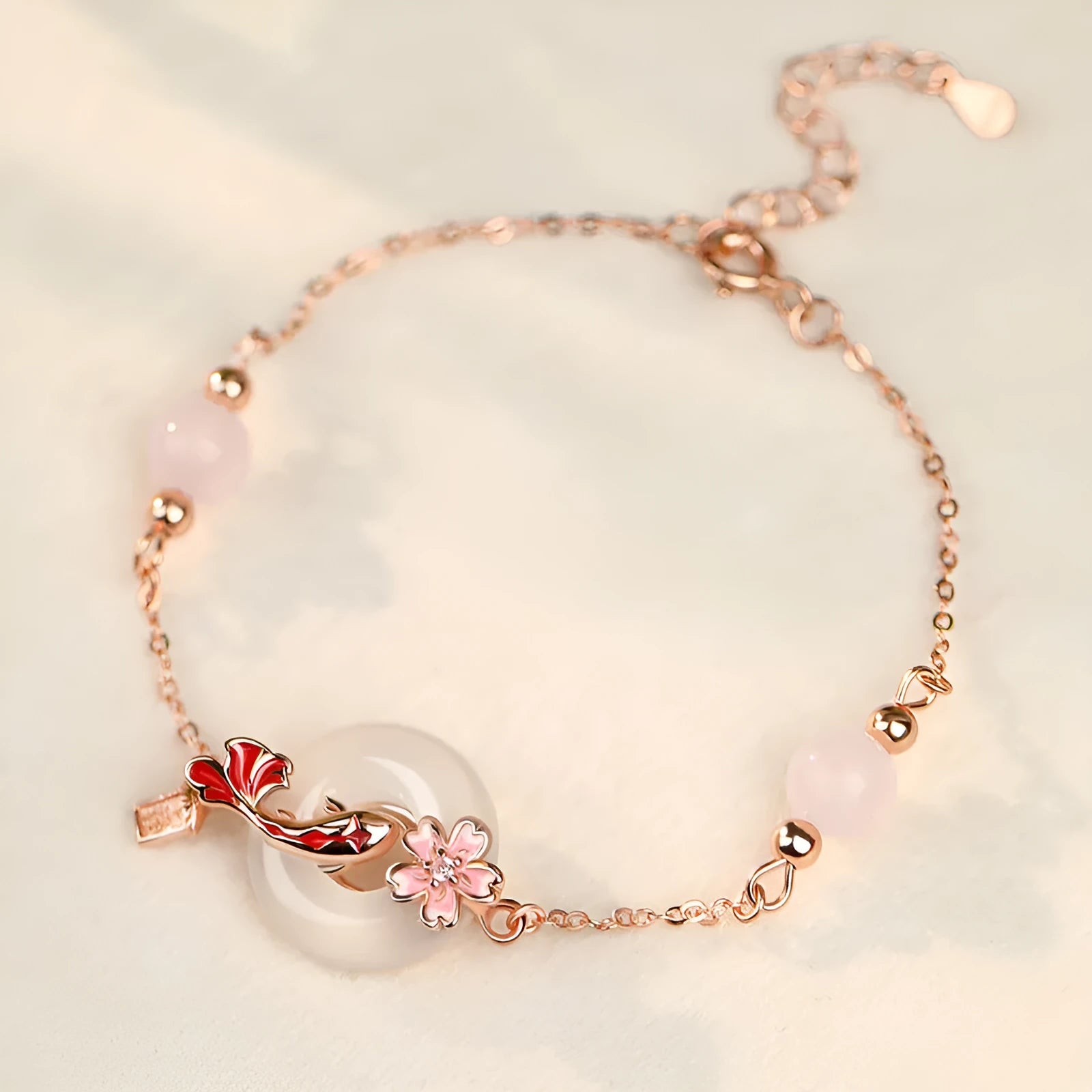 S925 sterling silver bracelet with white chalcedony crystal in a flower and koi pattern design.