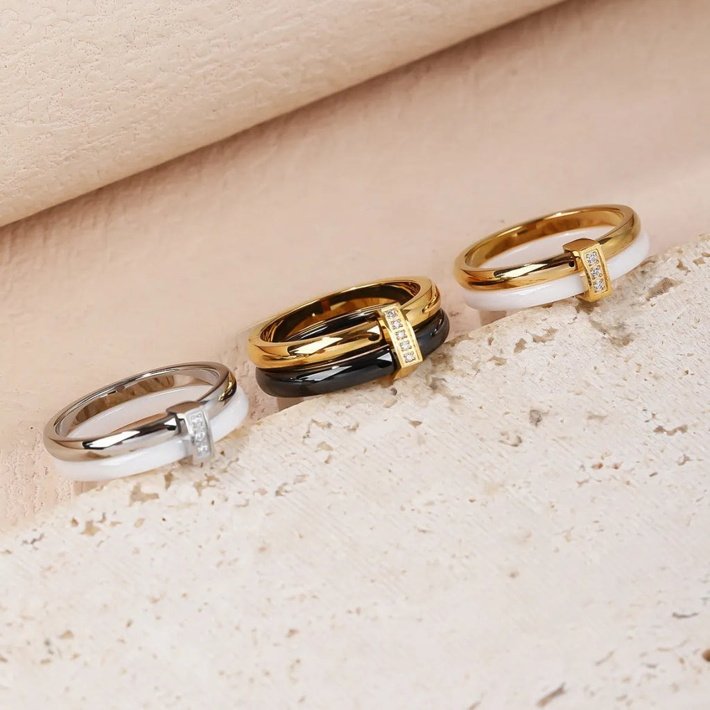 Women's heart-shaped double ring made of titanium steel with glossy stitching and zirconium inlay.