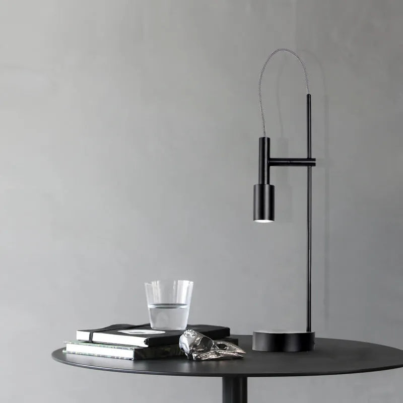 Simple modern rotating table lamp in sand black finish with wrought iron base and adjustable head