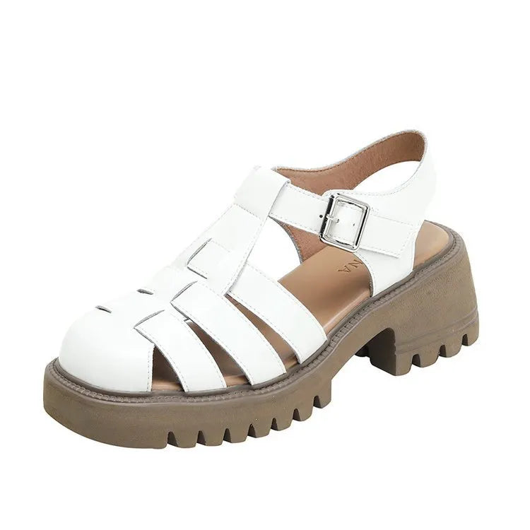 Women's black retro platform sandals with a chunky heel, closed toe, and buckle fastening.