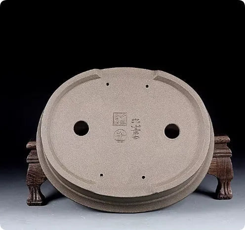 Handmade antique oval bonsai flower pot made from purple sand clay, dimensions 25x21x6.3 cm.