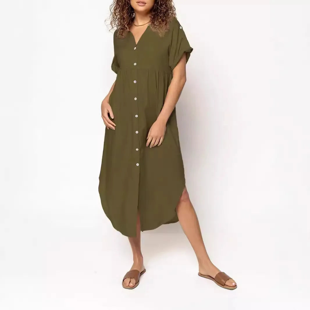A loose-fitting mid-length casual dress with a button-down front, shown in a solid colour.
