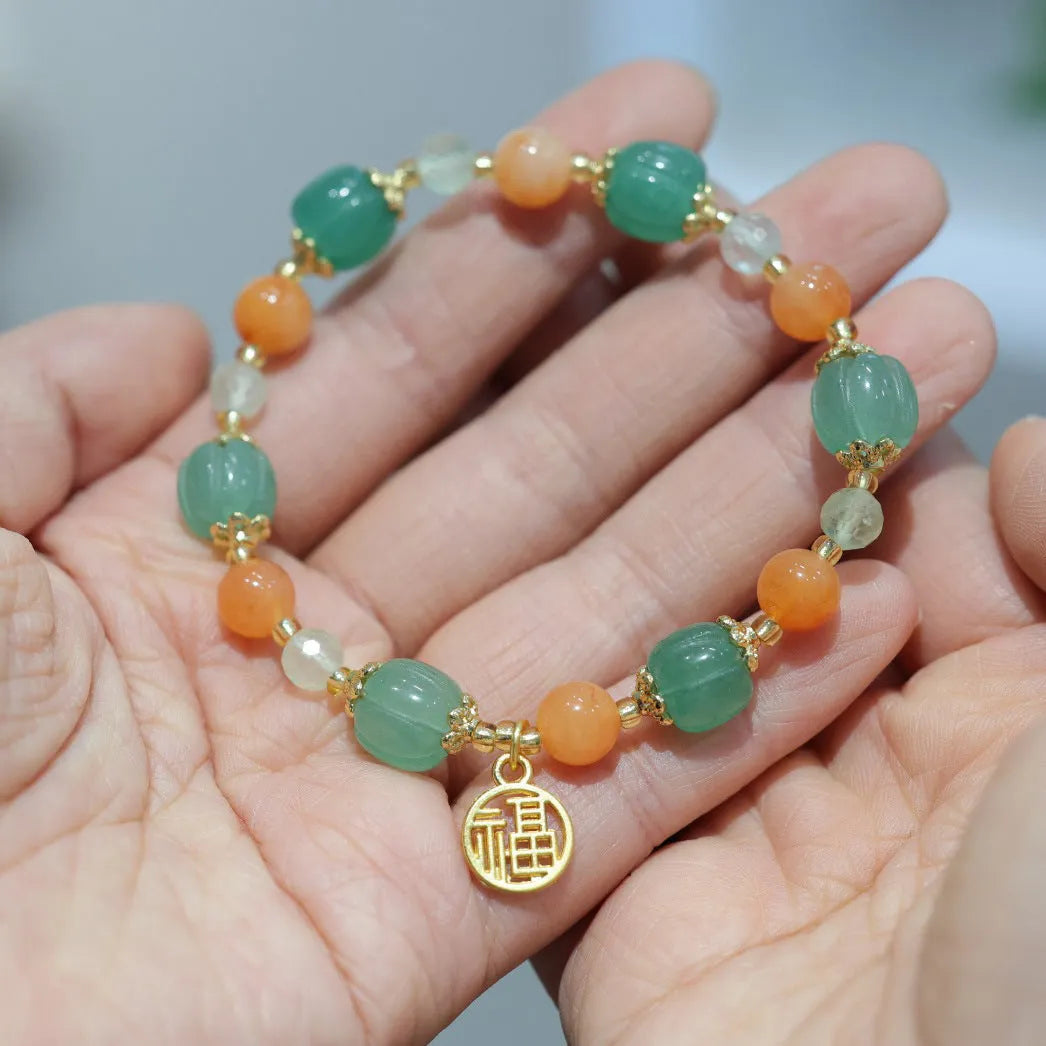Traditional Chinese Duobao pumpkin bracelet with Jinsi Jade barrel beads and Fuka hanging charm