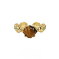 Adjustable silver ring with a white shell and tiger eye stone, featuring an electroplated gold finish.