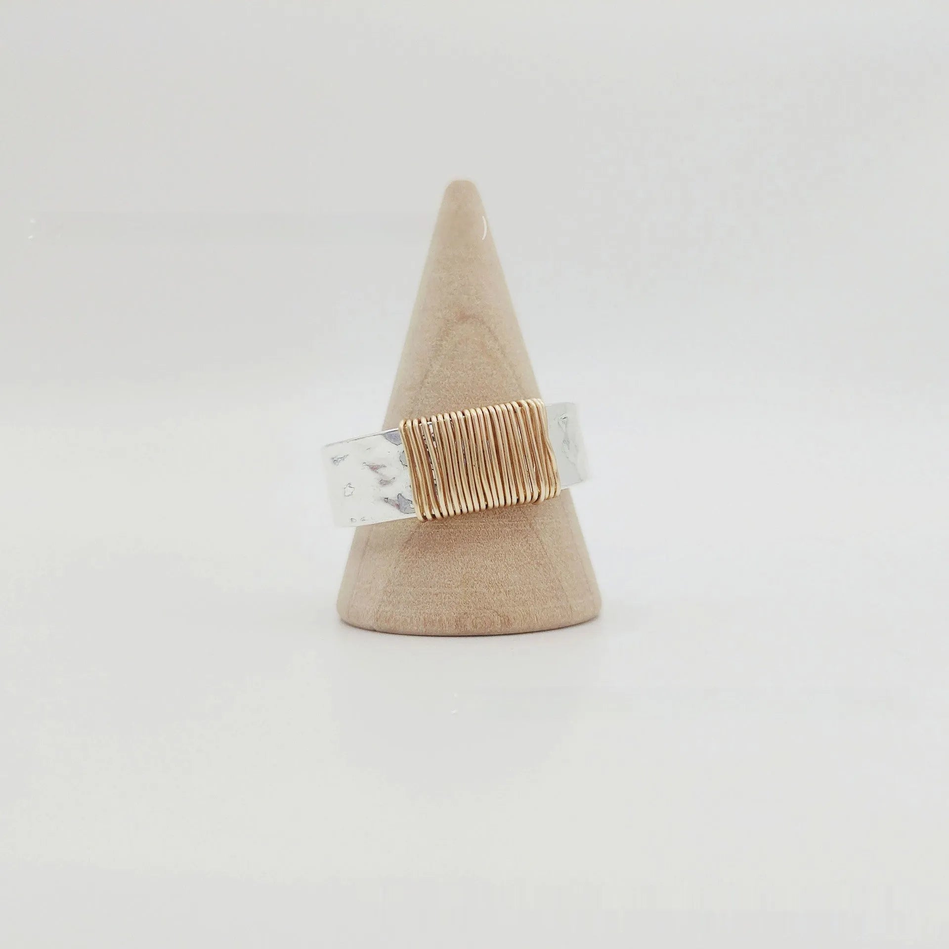 Copper geometric ring with silver golden electroplated finish and irregular vintage coil design.