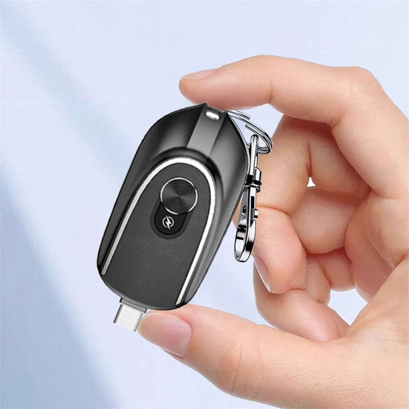 Black mini keychain power bank with Type-C and iPhone outputs, 1200mAh, hanging buckle, 71 x 19.5 x 38mm