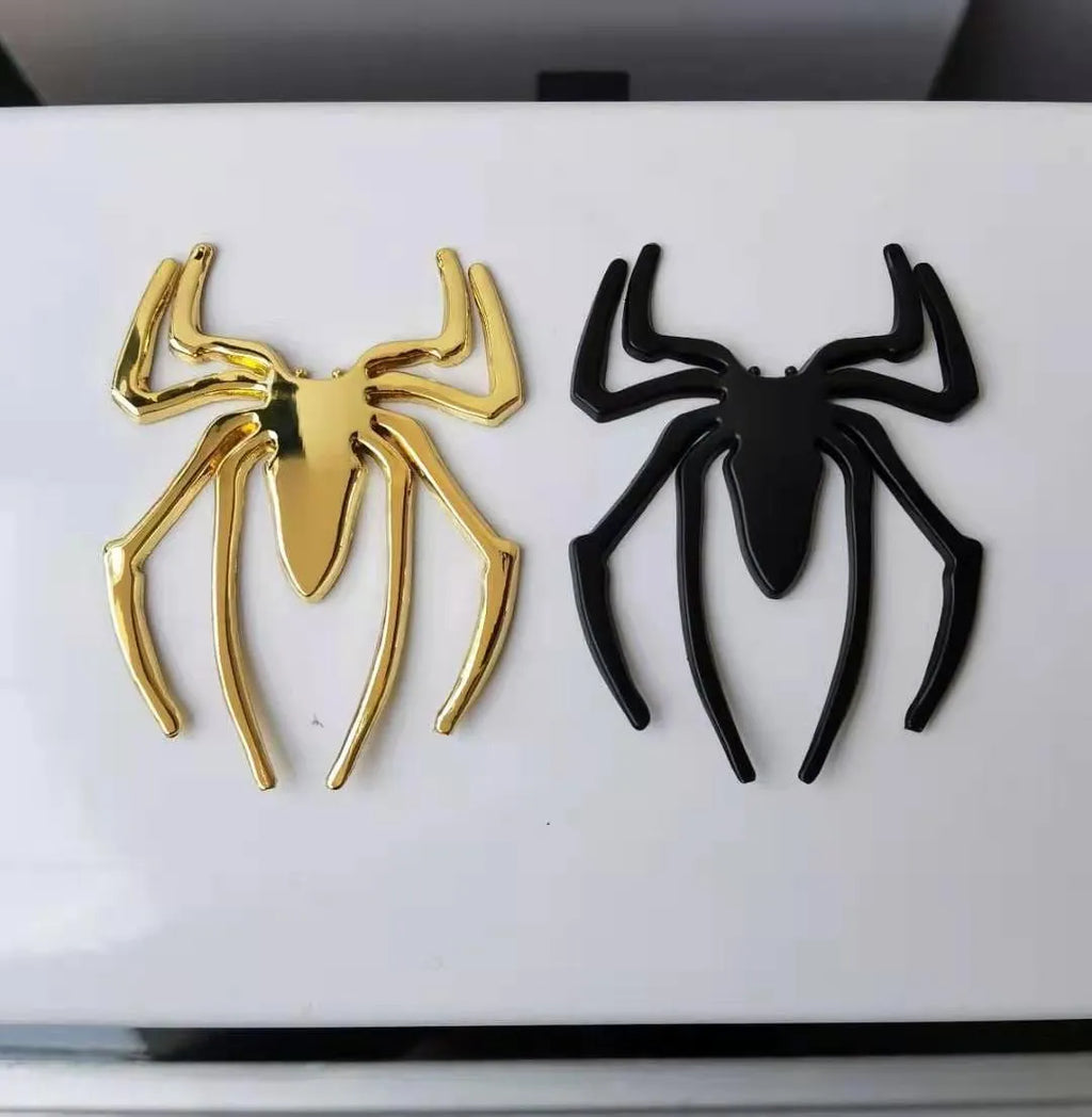 3D metal spider bumper sticker in gold on a car bumper