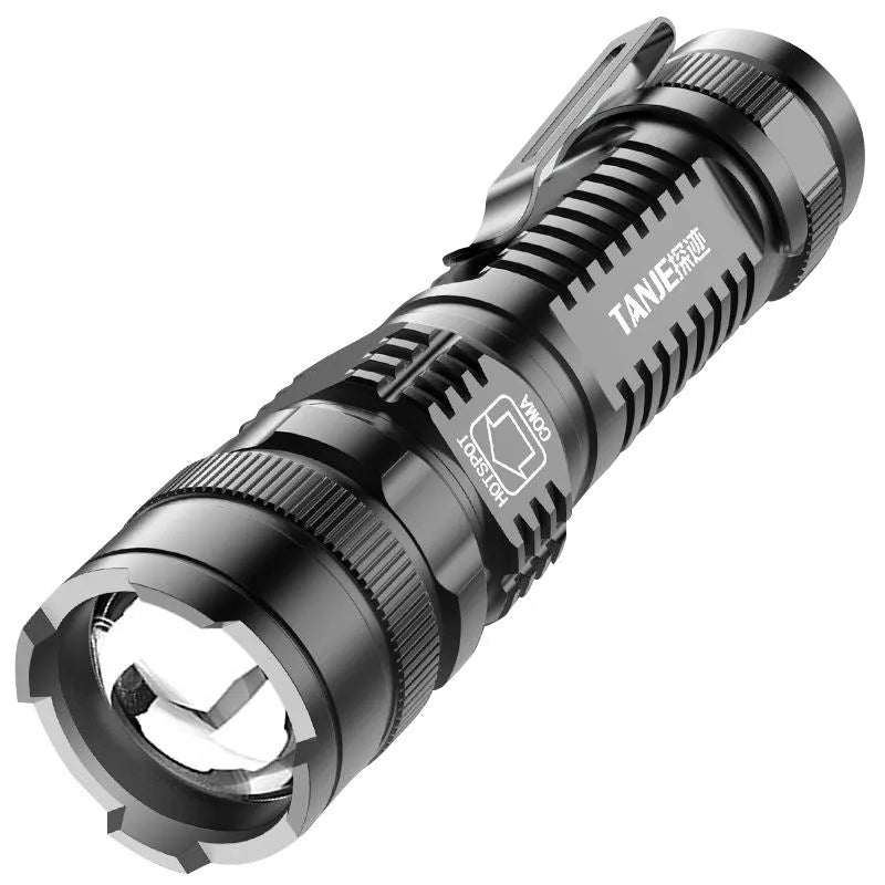 Small black aluminium telescopic LED flashlight with zoom adjustment and a pocket clip.
