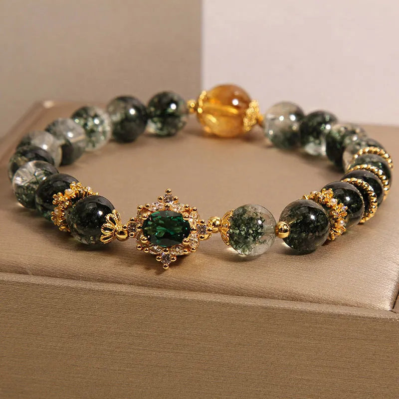 Gold rutilated quartz crystal bracelet with green phantom quartz and visible rutile inclusions