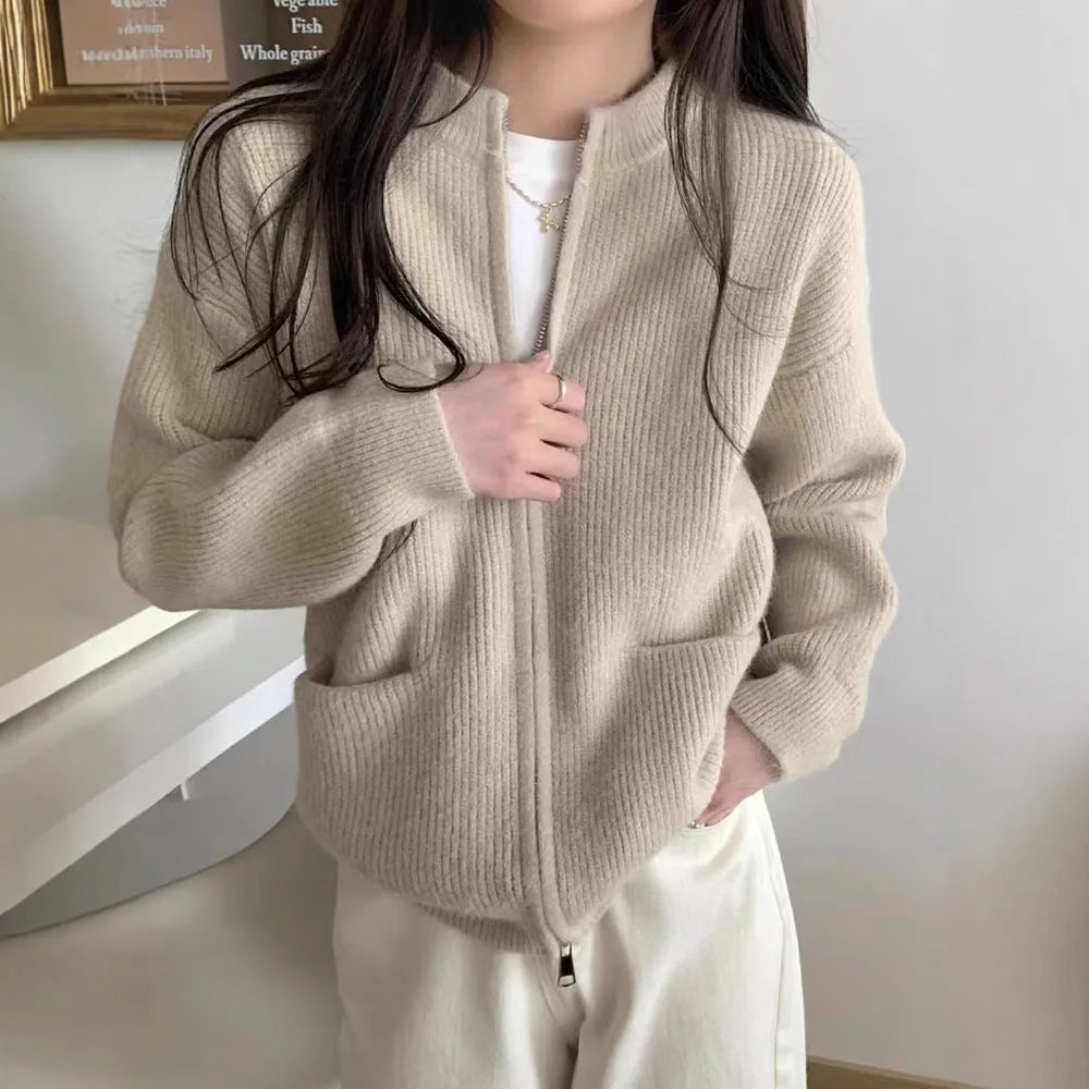 Beige viscose fibre long sleeve sweater coat cardigan laid flat.