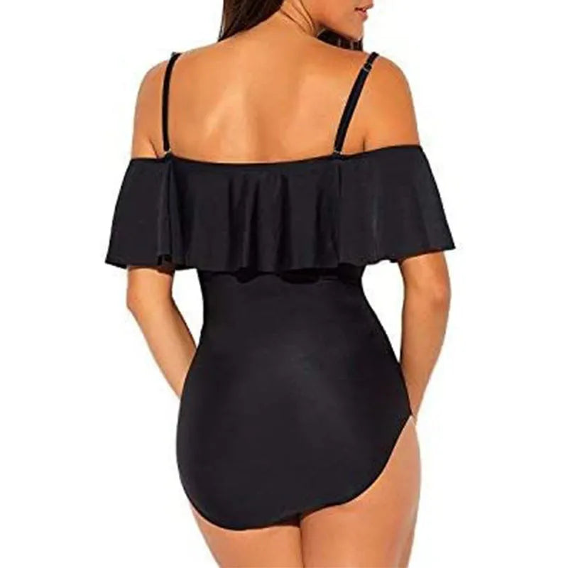 Black one-piece swimsuit with ruffled straps and cut-out details on a mannequin.