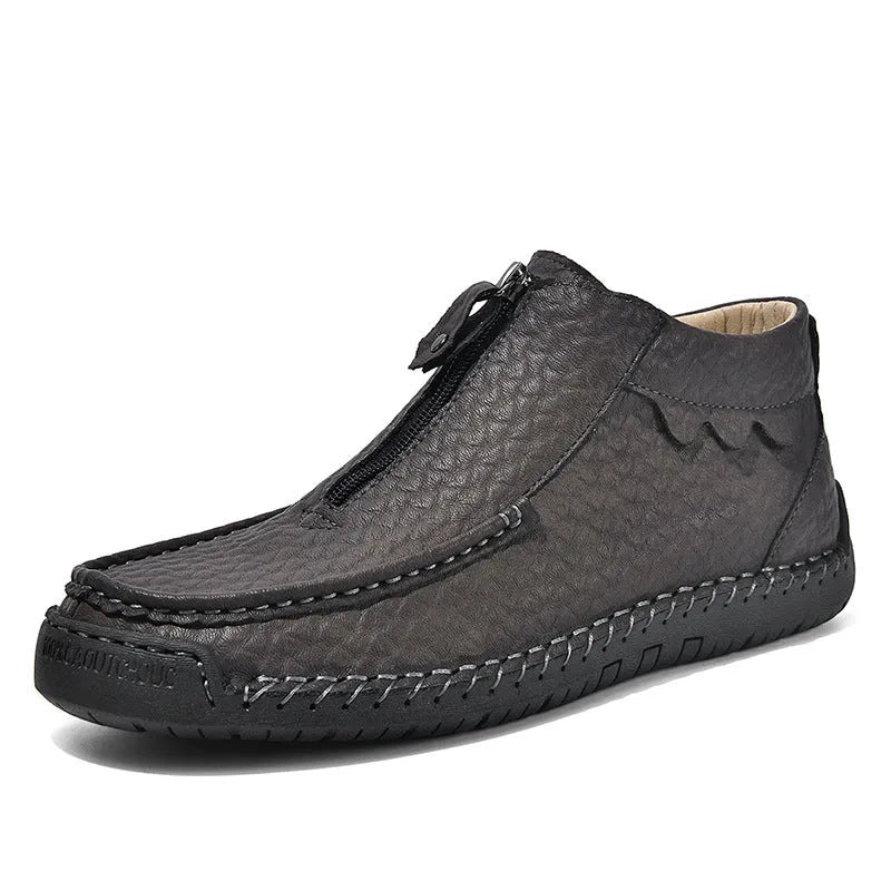 Men's black slip-on leather loafers with round toe and sewn sole on a rubber outsole.