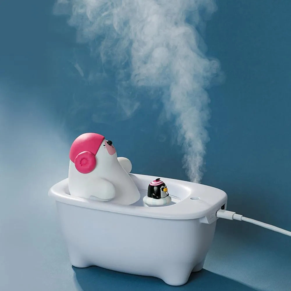 White USB desktop air humidifier with large water tank showing mist output.