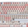 Pink PBT keycap set with 3D sublimation pig design and keycap puller.