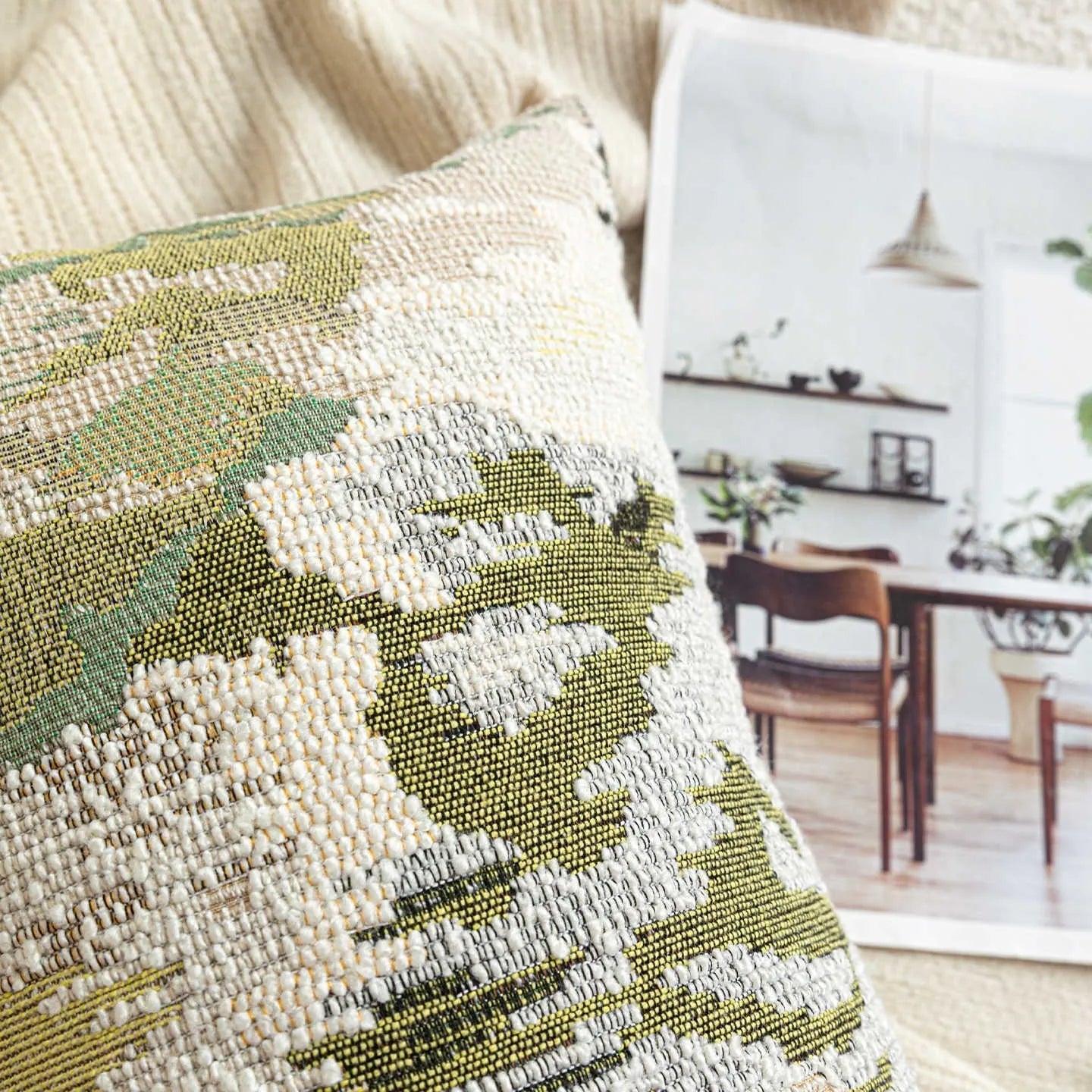 Antique green wool blend cushion with abstract spring flowers pattern in square and rectangular sizes.