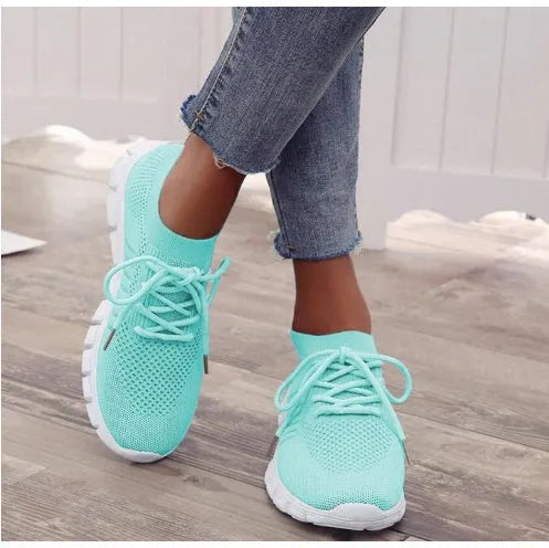 Women's high-cut lace-up casual sneaker in multiple colours on a flat heel with rubber sole