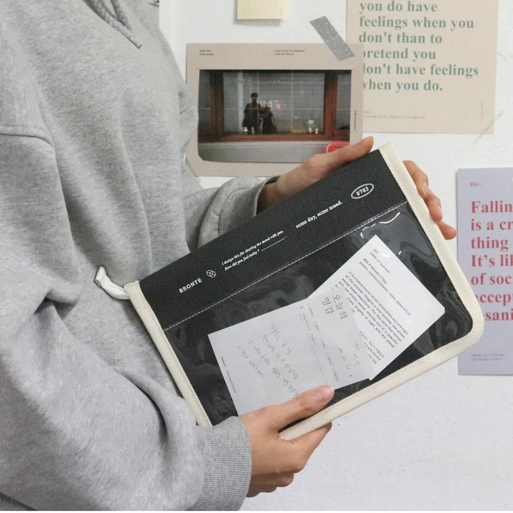 12 inch canvas tablet sleeve bag with zip opening, soft handle, clutch style, in black or white.