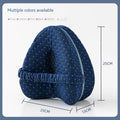 Love heart shaped memory foam leg pillow in dark blue jacquard fabric, shown next to a tape measure indicating 25x23x13 cm dimensions.