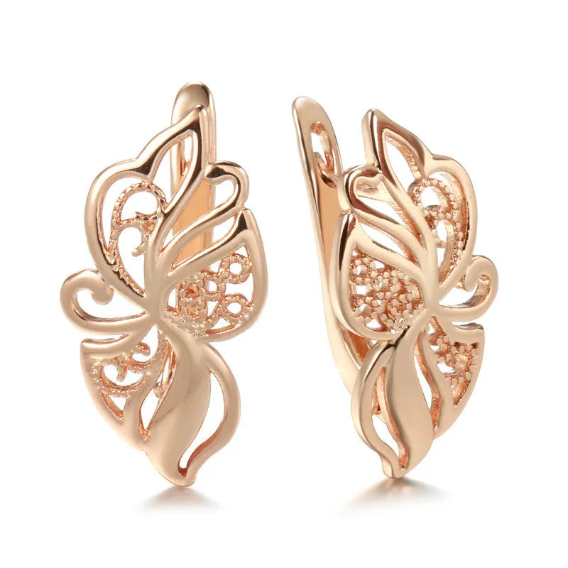 Rose gold geometric earrings for women with hollow carved copper design and rhinestone accents, one pair