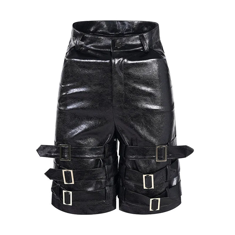 Black men's cropped PU leather shorts with ring detail on a hanger