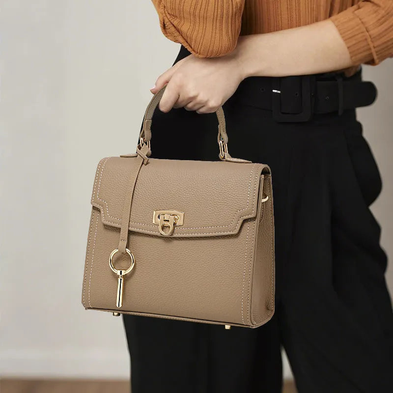 Elephant grey genuine leather handbag with vintage lock and crossbody strap