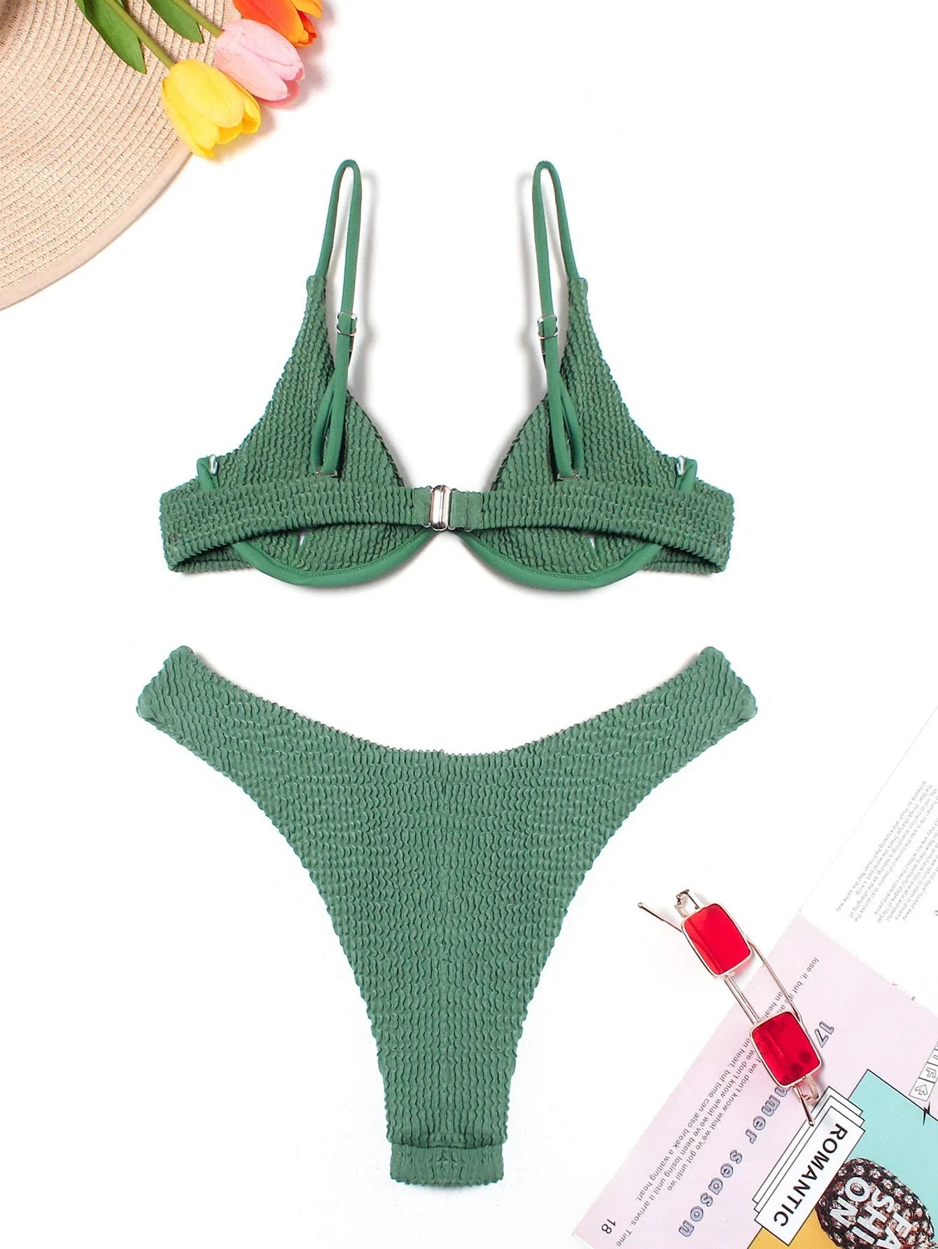 Green women's bikini swimsuit with ruffle detailing and briefs style