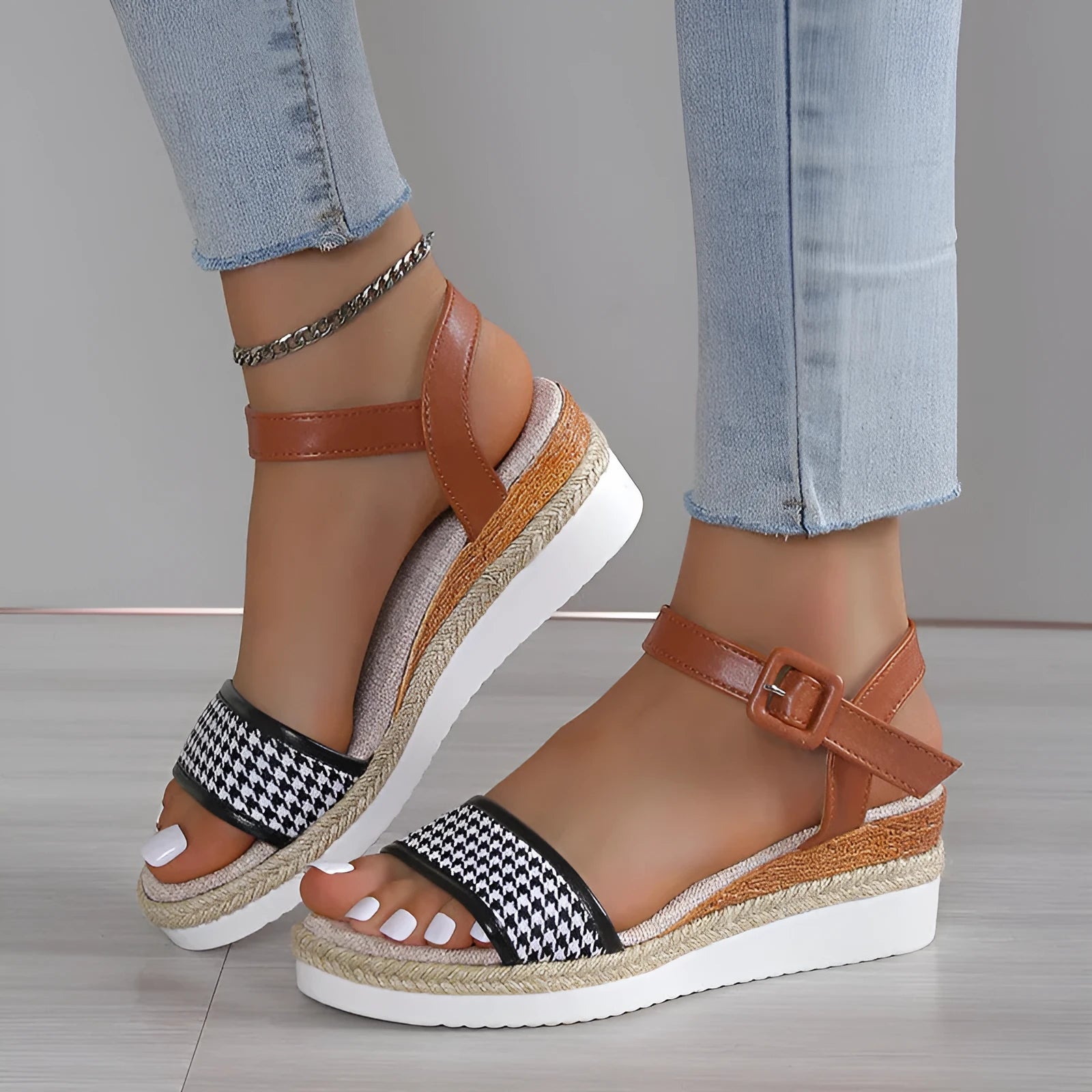 Women's houndstooth print buckle sandals in black with fish mouth toe on light background