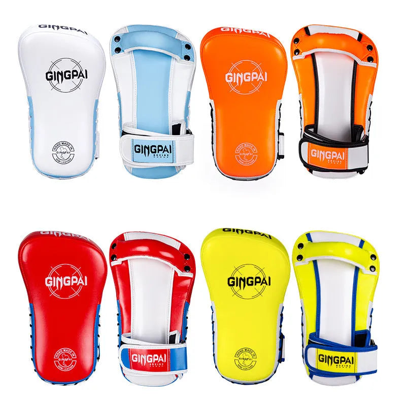 A pair of children's hanging boxing leg target pads in red PU foam for martial arts training.