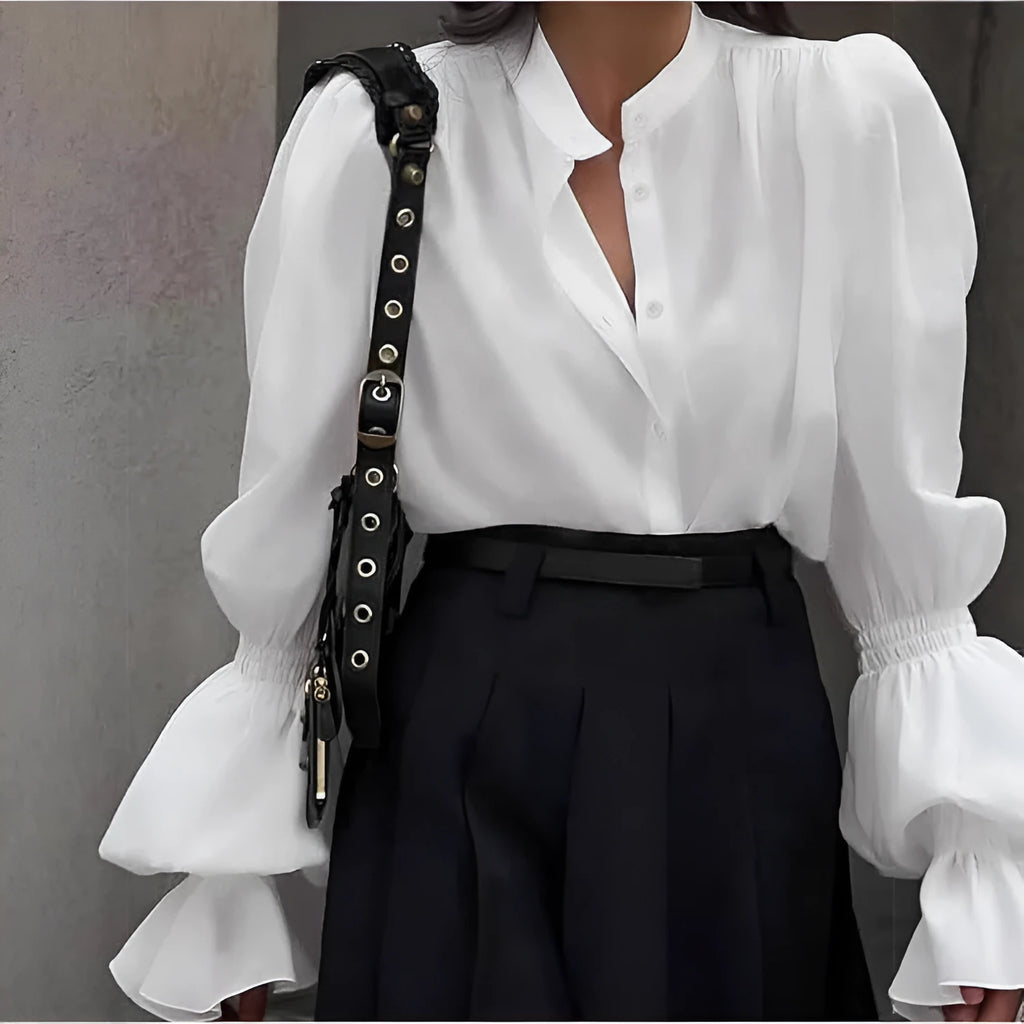Solid colour polyester women's shirt with lantern sleeves and ruffle detail, available in white, pink, and black