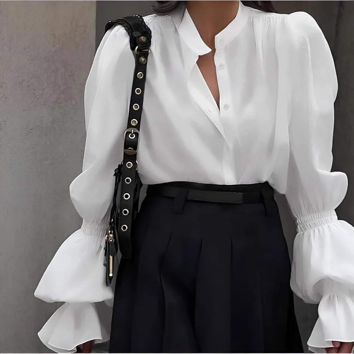 Solid colour polyester women's shirt with lantern sleeves and ruffle detail, available in white, pink, and black
