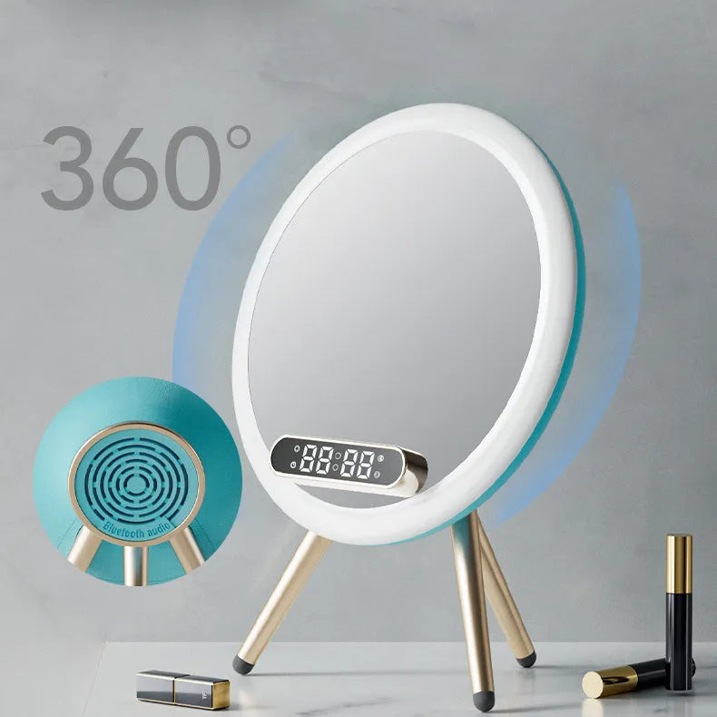 Multi-function LED mirror alarm clock with wireless charger and Bluetooth speaker in white colour on wooden desk