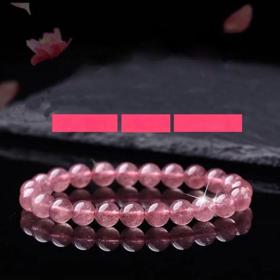 Women's strawberry quartz bracelet with polished beads in 6mm, 8mm, or 10mm sizes