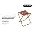 Black aluminium alloy folding stool in a portable design for outdoor camping and fishing.