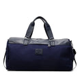 Black Oxford cloth large capacity messenger bag with a top handle and adjustable shoulder strap.