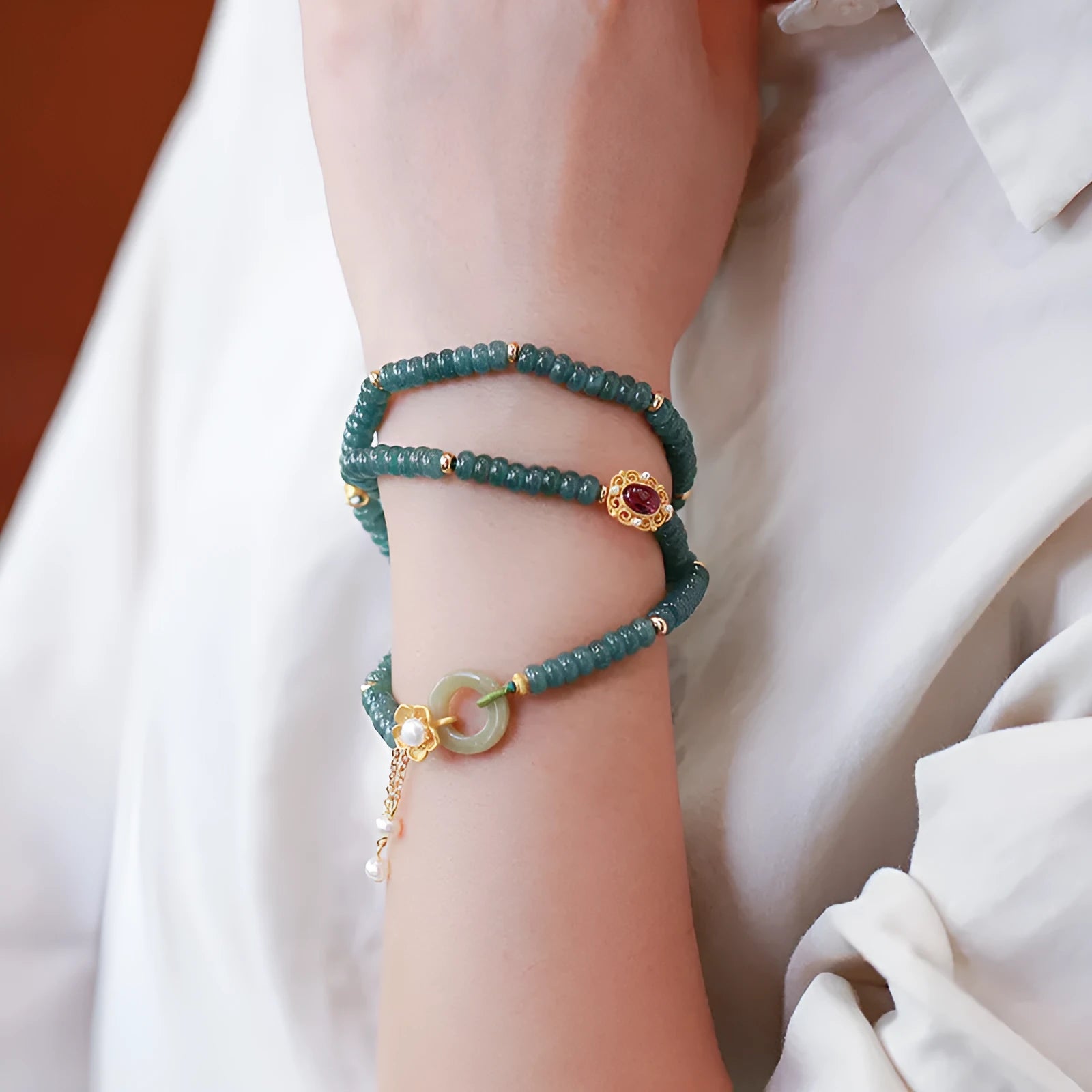 Blue water jade abacus bead and tourmaline ring bracelet with pearls under 4mm.
