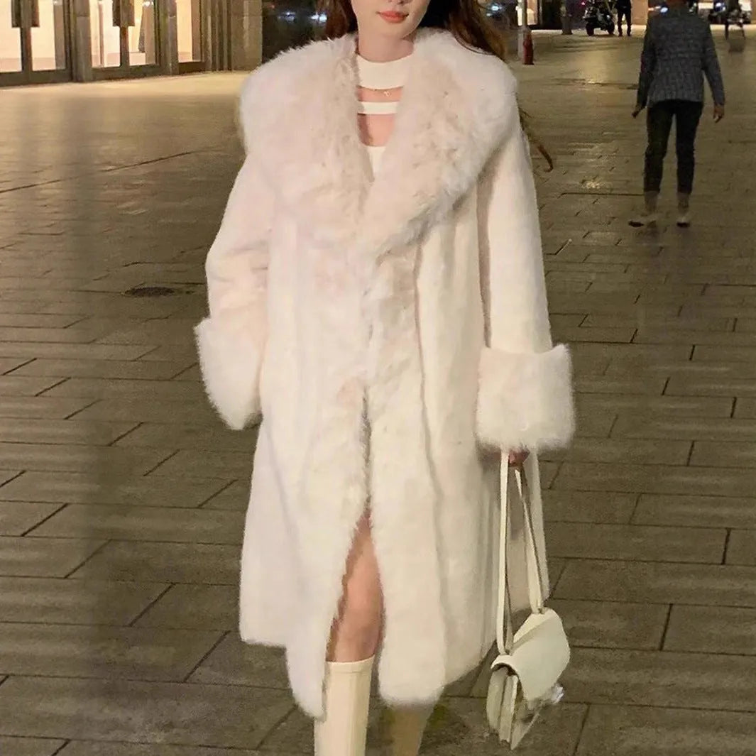 Women's grey thick faux fur mid-length coat with a collar on a model.