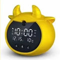 Smart alarm clock with silicone shell, luminous display, featuring voice and motion sensor controls.