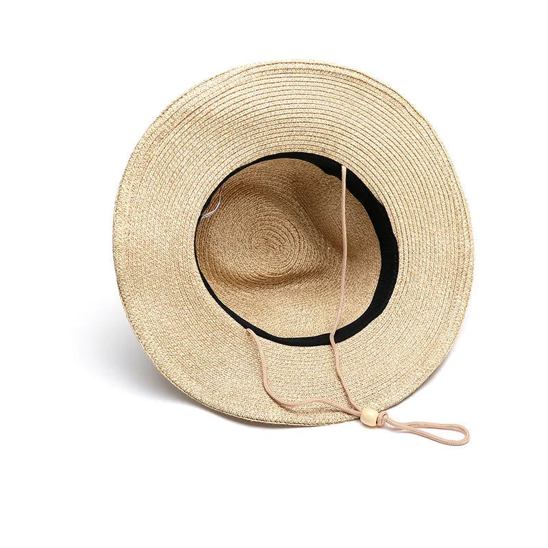 A foldable straw sun hat for men with a wide brim, shown in a beige colour.