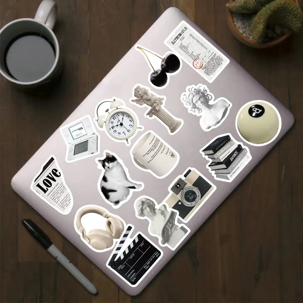 Set of 61 black and white waterproof PVC stickers for laptops, phones, luggage, and other personal items.