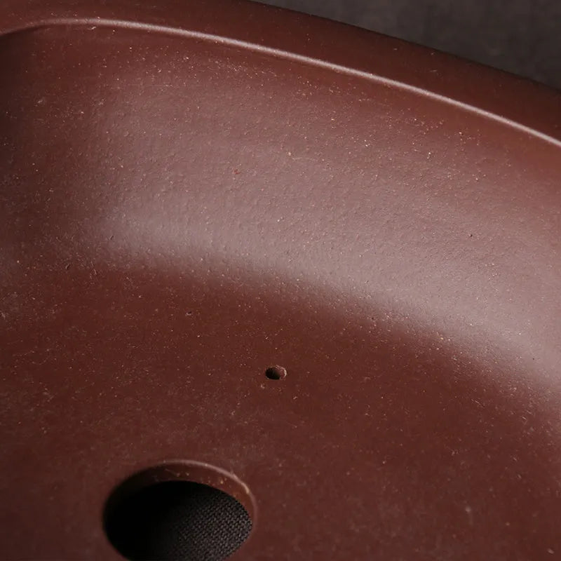 Handmade purple clay Chinese style bonsai pot measuring 25 cm long by 20 cm wide.