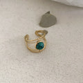 Titanium steel geometric open ring with JZ0379 green natural stone centrepiece