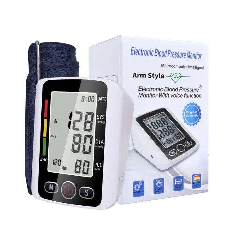 Automatic arm blood pressure monitor on a table with large screen and arm cuff.