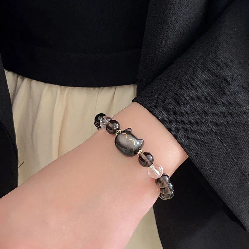 Women's silver tone bracelet with 8mm ice stone opal cat head charm and adjustable chain