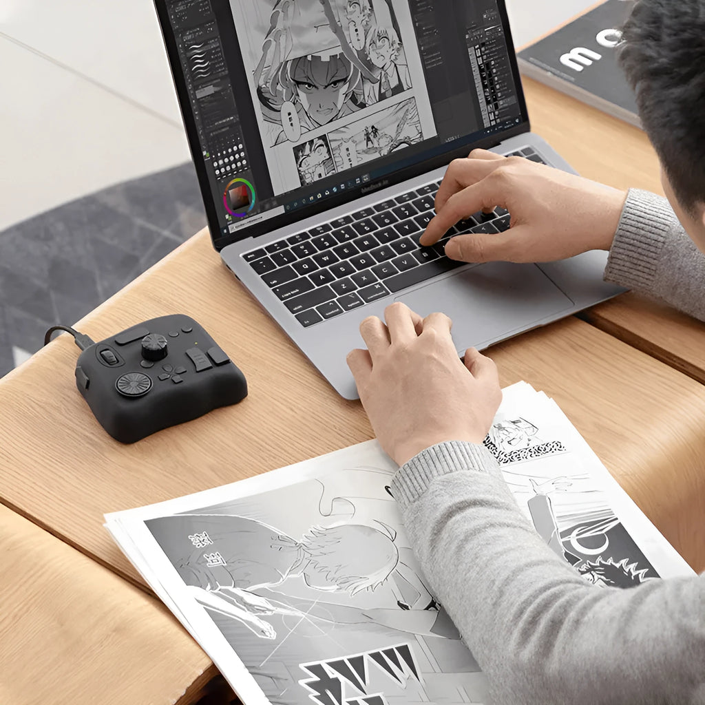 TourBox NEO black auxiliary keyboard controller for video editing on a desk.