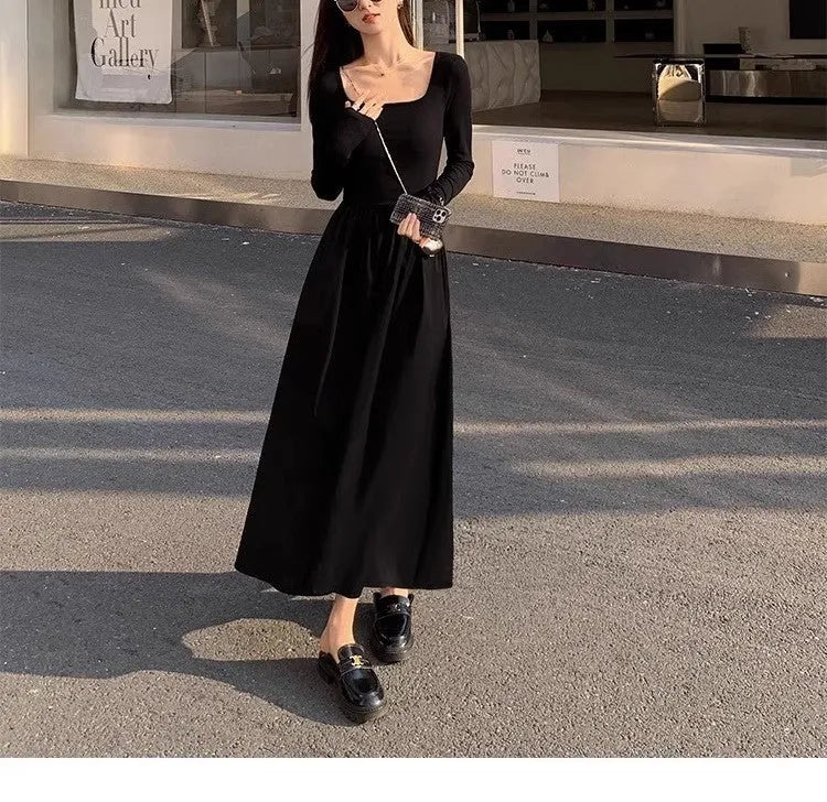 Women's black square collar knitted A-line dress with long sleeves and elastic waist.