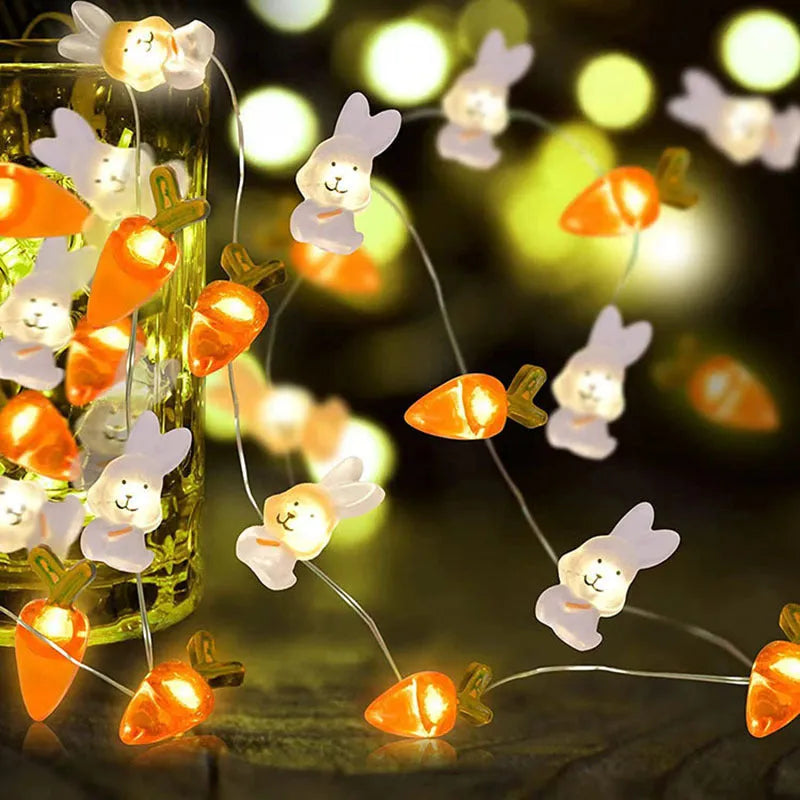 Easter carrot and rabbit shaped battery-operated LED decorative string lights on a dark background.