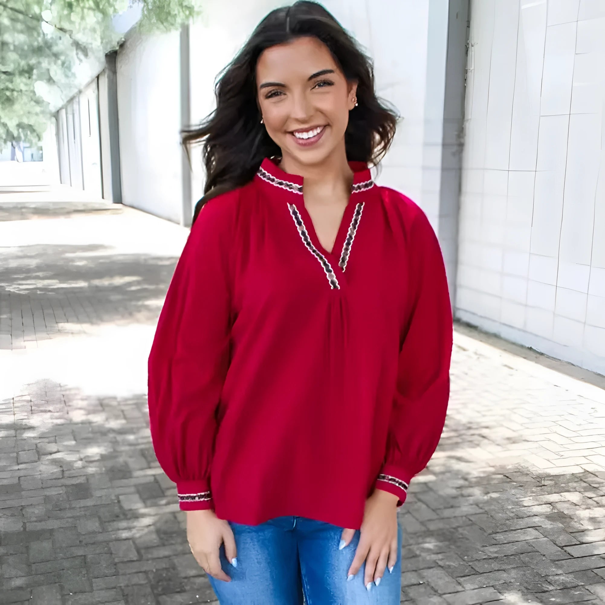 Women's red loose fit polyester pullover shirt with embroidered collar and printed detail