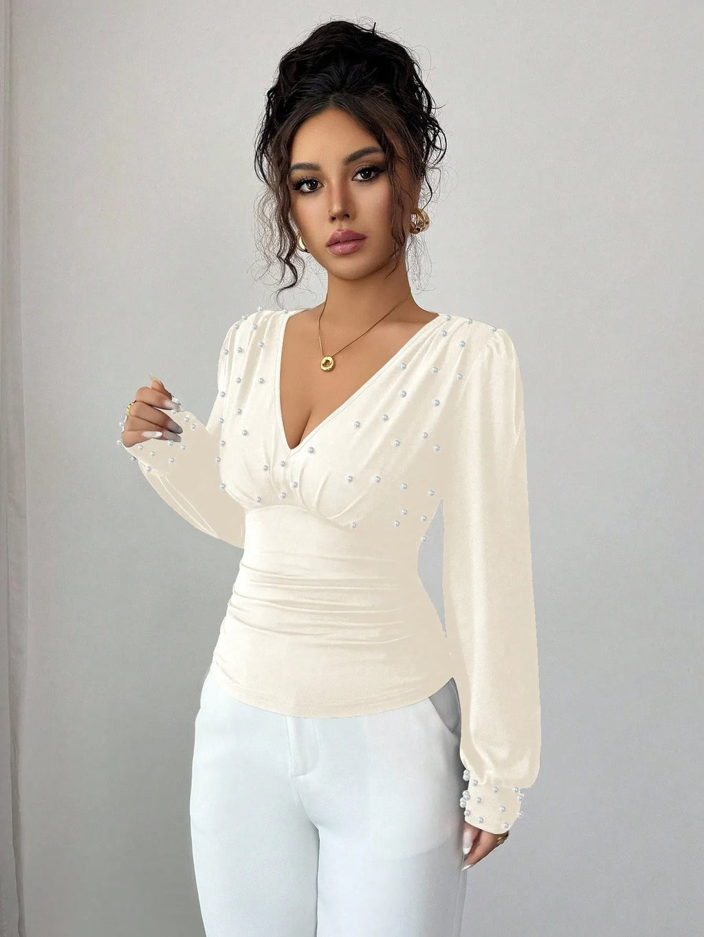 Women's V-neck solid colour fitted t-shirt with long bell sleeves in black, wine red, or apricot.