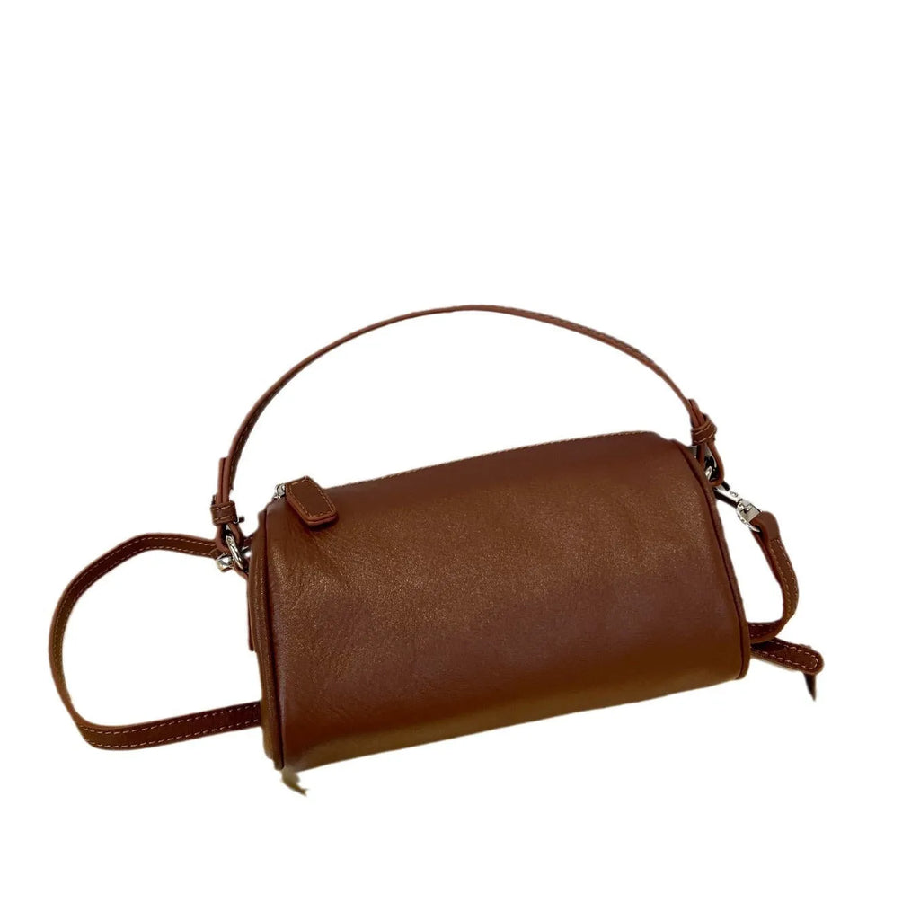 Genuine leather mobile phone crossbody bag with cylindrical design in six colour options showing sewing thread detailing