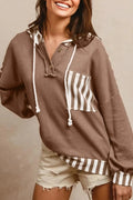 Straw yellow women's hoodie with waffle texture and striped patchwork design, featuring a button neck and drawstring waist.